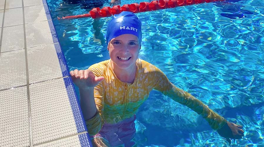 A student in the pool at the school swimming carnival